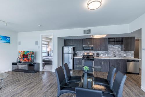 a kitchen and dining room with a table and chairs at 2 Bed 2 Bath X street LA Live, Convention Center, Microsoft Theater in Los Angeles