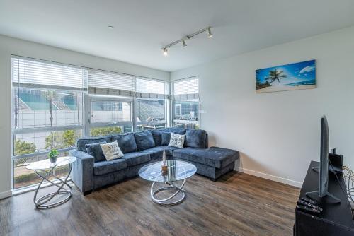 a living room with a couch and a tv at 2 Bed 2 Bath X street LA Live, Convention Center, Microsoft Theater in Los Angeles
