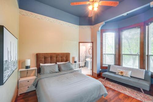 a bedroom with a large bed and a couch at Modesto Mansion on 2 Acres - Great for Families! in Modesto