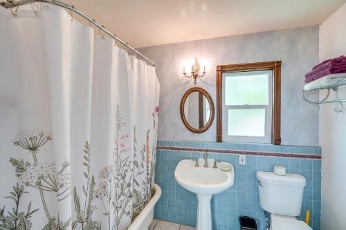 a bathroom with a toilet and a sink at Modesto Mansion on 2 Acres - Great for Families! in Modesto