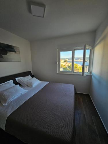 Ένα ή περισσότερα κρεβάτια σε δωμάτιο στο Wanderlust Apartment