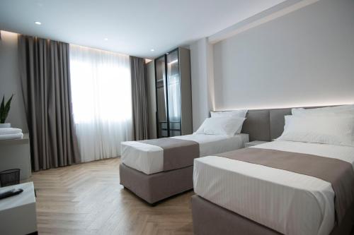 Postel nebo postele na pokoji v ubytování Mina Luxury Rooms