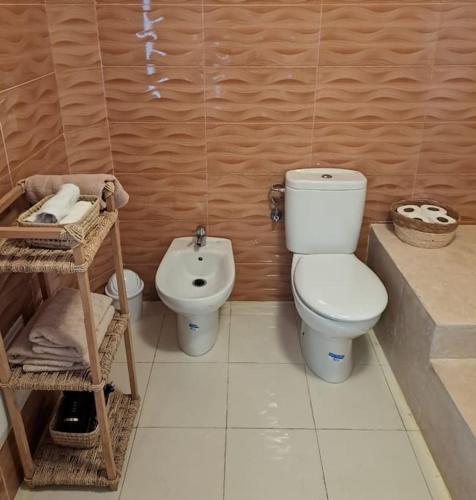 a bathroom with a toilet and a bidet at Tanger, Vue Mer Panoramique in Noûnouech