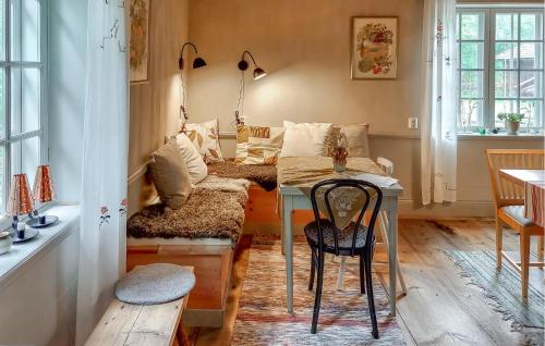 a living room with a table and a couch at Lovely Home In Borlänge With Sauna in Borlänge