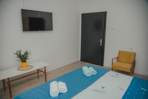 Postel nebo postele na pokoji v ubytování Jes Apartments