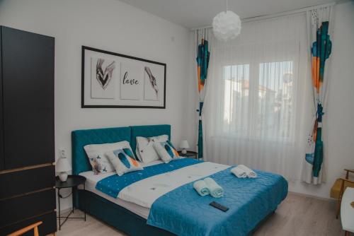 Postel nebo postele na pokoji v ubytování Jes Apartments