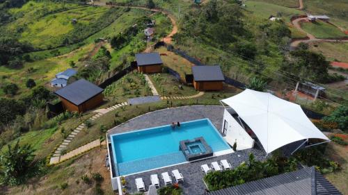 an aerial view of a house with a swimming pool at Entre Nubes Eco Hotel in El Queremal