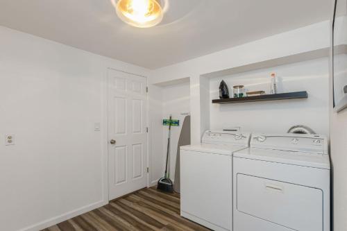 a white laundry room with a washer and dryer at Entire Cozy Home With Pool in Mesa