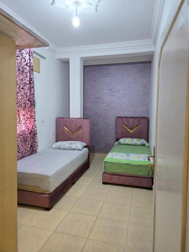 Postel nebo postele na pokoji v ubytování Appartement à louer wadie
