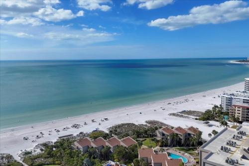 an aerial view of a beach and the ocean at 6415 Midnight Pass #304 in Siesta Key