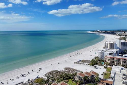 an aerial view of the beach in destin at 6415 Midnight Pass #304 in Siesta Key