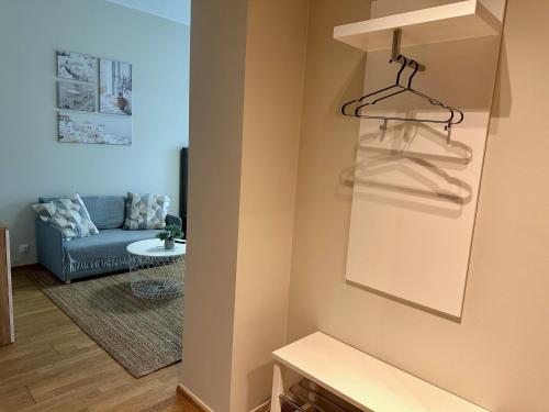 a living room with a couch and a hanger at Aisa 39 in Pärnu