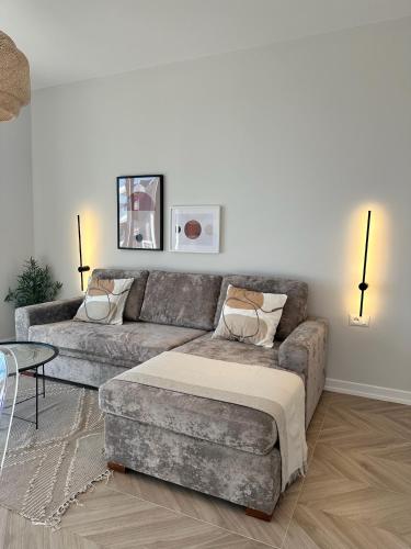 a living room with a couch and a table at Veronica Apartment in Sarandë