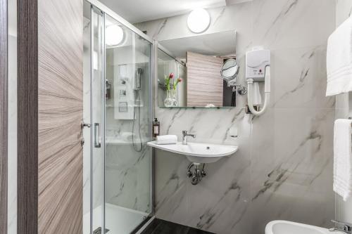 a bathroom with a shower and a sink at Hotel Centro Cavour Roma in Rome