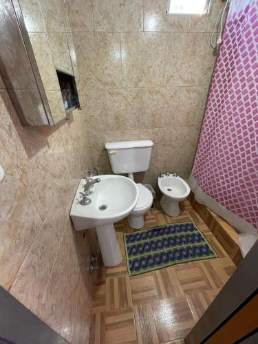 a bathroom with a sink and a toilet at departamento nicolay in Junín