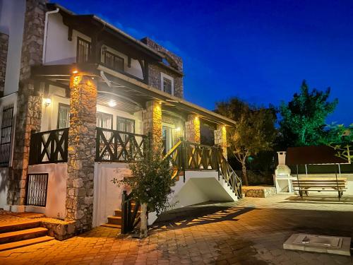 a house with lights on the side of it at Villa Deniz in Fethiye