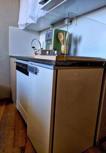 a kitchen with a sink and a counter top at Alpe d'Huez - Éclose in LʼHuez