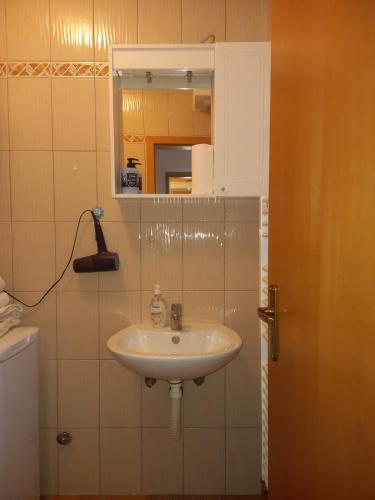 a bathroom with a sink and a mirror at Klara in Tomislavgrad
