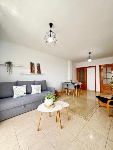 a living room with a couch and a table at Vista Montemar in San Miguel de Abona