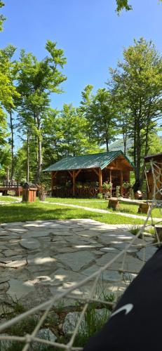 a gazebo with a pavilion in a park at Bungalows Prokletije in Gusinje