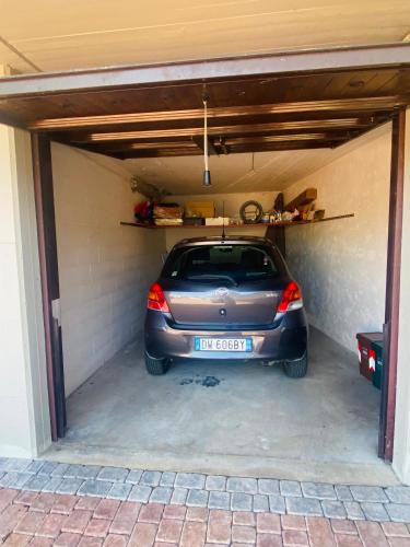 a car is parked in a garage at OLIVIA LODGE in Sulzano