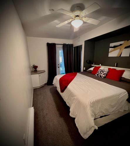a bedroom with a bed and a ceiling fan at Modern Dream at Fairmont in Fairmont Hot Springs