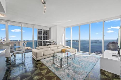 a living room with a couch and a view of the ocean at Icon Brickell Residences in Miami