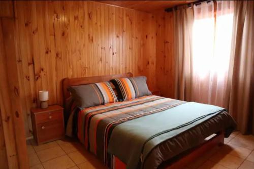 Postel nebo postele na pokoji v ubytování Cabañas Soelafquen