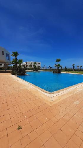 Бассейн в Sidi Rahal Blue Beach Appartement Pieds Dans L'eau или поблизости