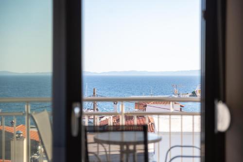 a view of the ocean from a balcony at Majestic house in Neos Marmaras