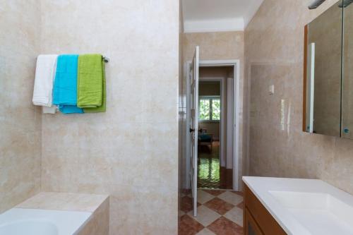 a bathroom with a shower and a sink and a mirror at Varanda dos Poetas in Lisbon