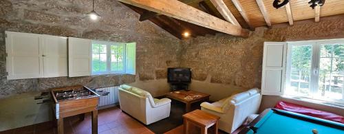 a living room with a pool table in a room at Quinta de S. Domingos - Viseu in Viseu