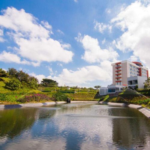 a view of a river with a building in the background at Sonesta Hotel Pereira in Pereira