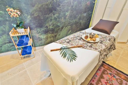 a room with a table with a plate of food on it at Sonesta Hotel Pereira in Pereira