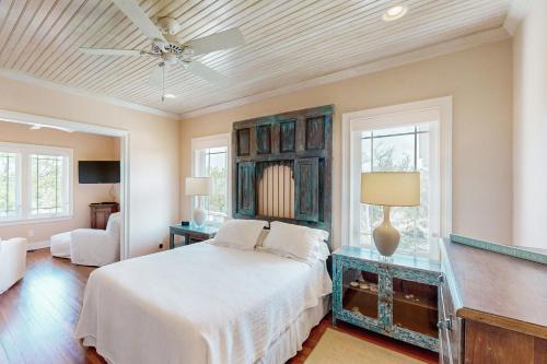 a bedroom with a bed and a ceiling fan at Sweet Carolina in Edisto Island