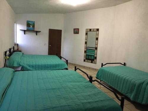 Postel nebo postele na pokoji v ubytování Casa Familiar Tepeji