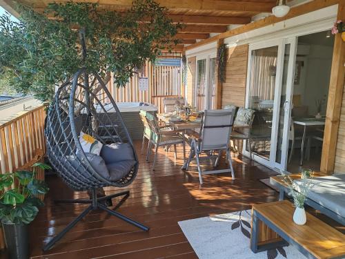 a porch with a hammock and a dining table at Annika Mar in Selce