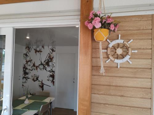 a door into a dining room with a table and flowers at Annika Mar in Selce