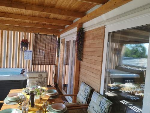 a dining room with a table and a large window at Annika Mar in Selce