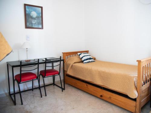 Ένα ή περισσότερα κρεβάτια σε δωμάτιο στο GOa Hospedajes