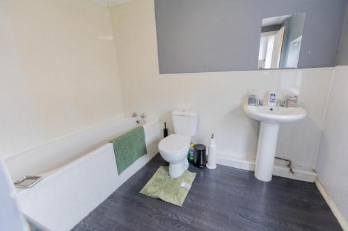 a bathroom with a toilet and a sink at 5 Star Homes- Free Wifi & Parking, Contractor & family friendly in Pallion