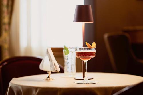 a table with two glasses of wine on it at Hotel Camigliatello in Camigliatello Silano