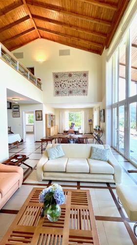 a living room with a couch and a table at The Cliffs - A Pedrinha in Viveiro
