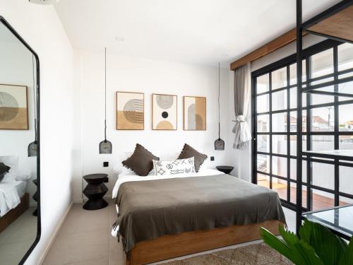 Ένα ή περισσότερα κρεβάτια σε δωμάτιο στο Tribeca Penthouse Canggu