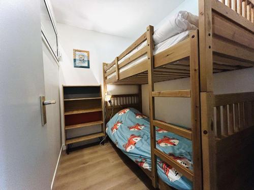 a bunk bed room with two bunk beds and a hallway at Studio lumineux proche plage, bois, marché - 4 pers, parking, animaux acceptés - FR-1-245-207 in Le Pouliguen