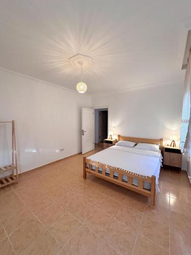 a large bedroom with a bed and a ceiling at Wonderful Sunset 1 in Bodrum City