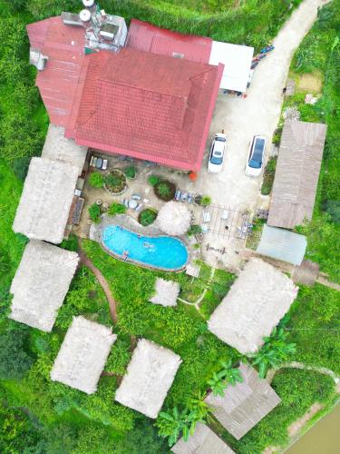 an aerial view of a house with a swimming pool at Bac Ha Lodge Retreat in Bắc Hà