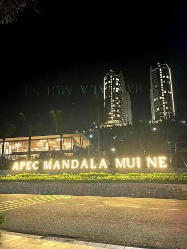 a sign that reads msg mandalaume in front of buildings at Apec Mandala Mũi Né, Phan Thiết in Ấp Long Sơn