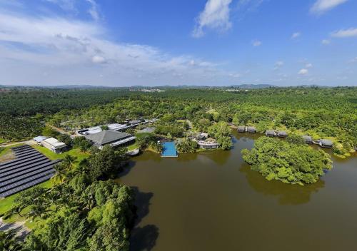 an aerial view of a resort on a river at Mangala Estate Boutique Resort - Small Luxury Hotels of the World in Kuantan