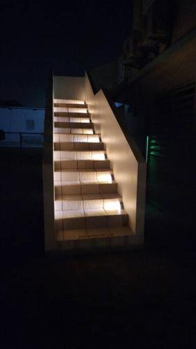 an overhead view of a set of stairs at night at Stargaze Comfort Under the Stars & Arcade Room in Aguadilla